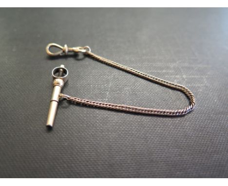 A watch key and safety chain - With toggle fitting - Tests as 18ct gold - Length of chain 14cms - Weight approx 4.8gms
Condit