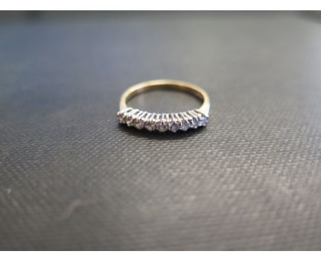 An 18ct gold diamond nine stone ring - Hallmarked London - Ring size M 1/2 - Weight approx 1.8gms
Condition Report: Good - Wi