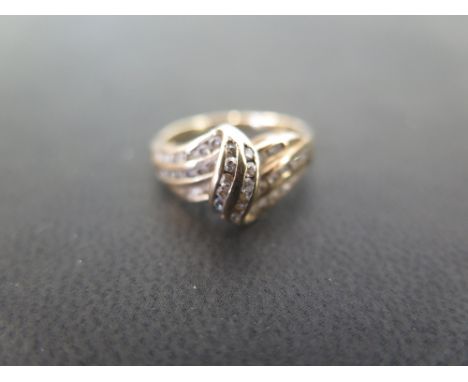 A three-row white-gem twist ring - Stamped 9ct - Ring size K - Weight approx 2.7gms
Condition Report: Good - With light surfa