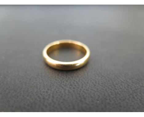 A 22ct gold band ring - Hallmarked Birmingham - Ring size K - Weight approx 3.9gms
Condition Report: Good - With light scratc