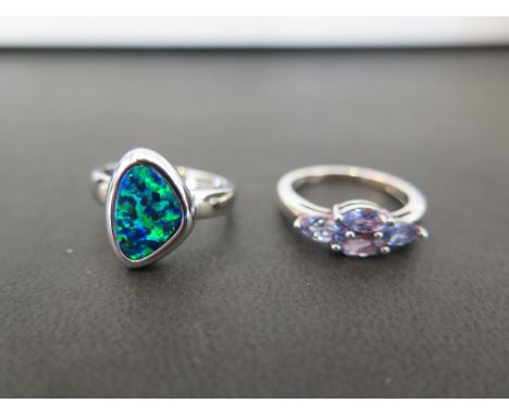 A tanzanite cluster dress ring - Ring size N - Together with an opal doublet ring - Ring size M - Both stamped 925 - Total we