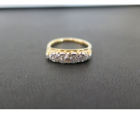 An old-cut diamond graduated five-stone ring - Estimated total diamond weight 0.50ct - Stamped 18 - Ring size M - Weight appr