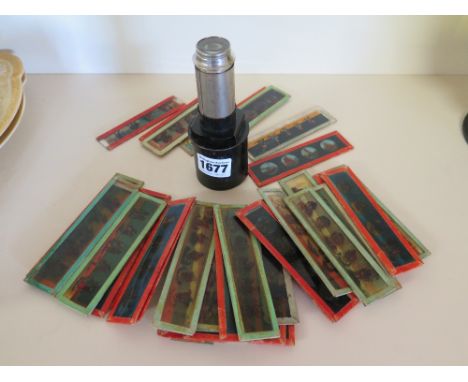 A collection of forty four small glass, torch magic lantern type slides and a viewing lens, German