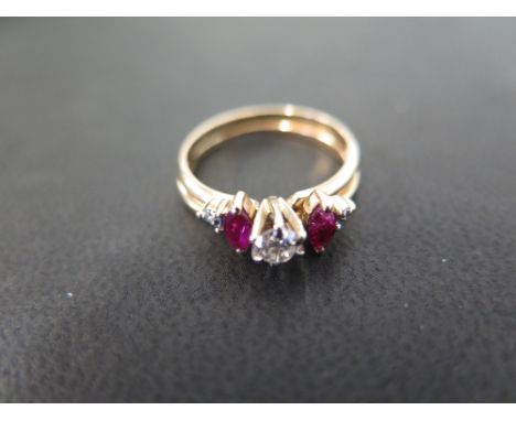 A ruby and diamond dress ring - Designed as two rings, one composed of a single brilliant-cut diamond, the other as two marqu