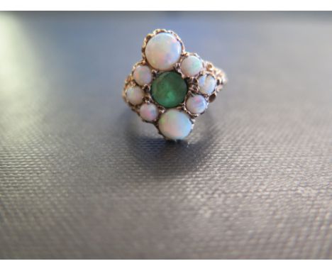 A 9ct gold opal and emerald cluster ring - Hallmarked London - Ring size M 1/2 - Weight approx 4.4gms
Condition Report: Fair 