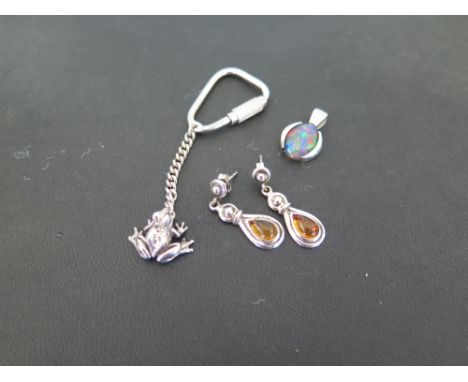 LEXIE DIX a silver frog key ring - Hallmarked London - An opal triplet pendant - Stamped 925 - Length 2cms - Together with a 