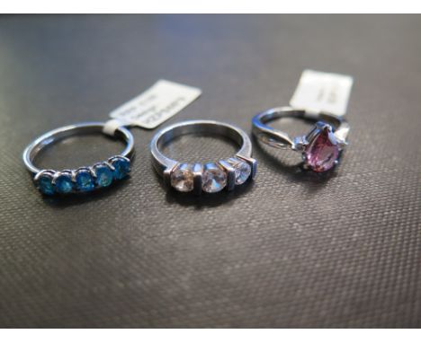 Three gem-set rings - To include apatite, zircon and tourmaline - Two stamped 925 - Ring sizes N, N 1/2 and S - Weight approx
