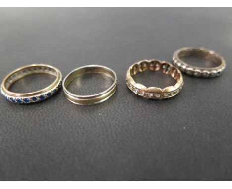 Three marcasite and gem-set full-circle rings - Together with a bi-colour band ring - Test silver and 9ct gold - Ring sizes N