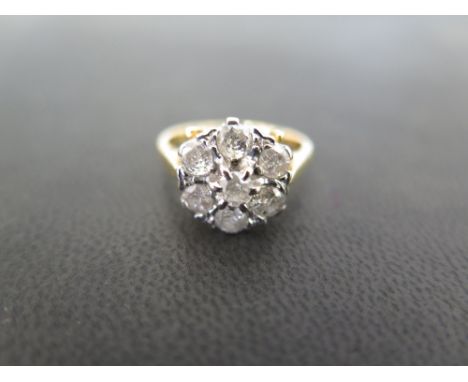 An 18ct gold brilliant-cut diamond daisy cluster ring - Estimated total diamond weight 1ct - Hallmarked London - Ring size I 