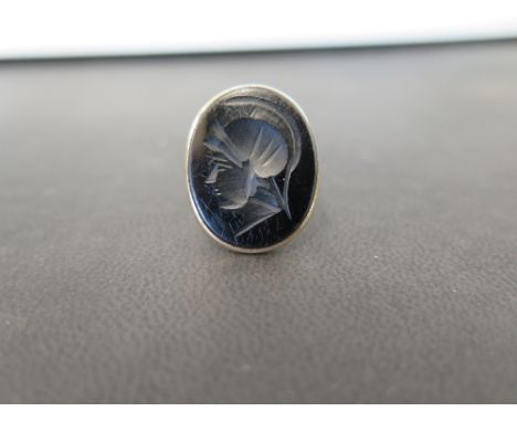 A 9ct gold carved jet cameo ring - Hallmark obscured - Ring size M - Weight approx 5.3gms
Condition Report: Good to fair - Wi