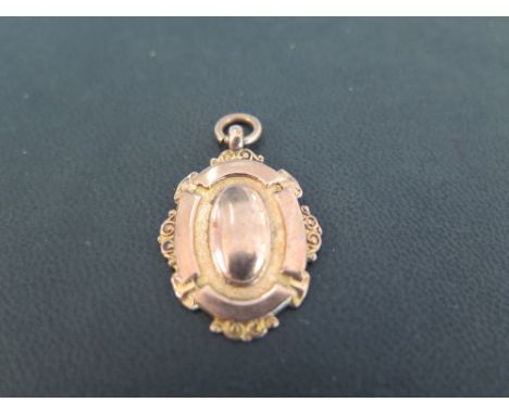 A mid 20th century 9ct gold pendant medal  - With reverse inscription dated 1949 - Stamped 9ct - Length 3.7cms - Weight appro