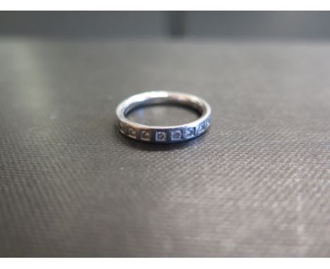 A platinum diamond band ring - Hallmarked Birmingham - Ring size M - Weight approx 5.2gms
Condition Report: Good to fair - Wi