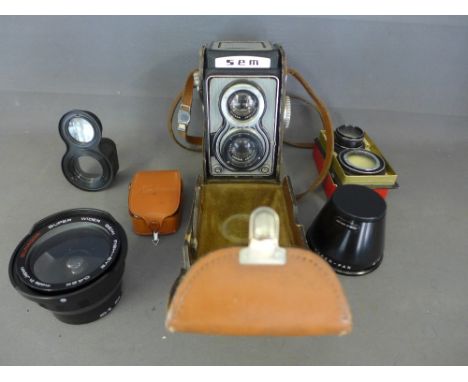 A quantity of camera equipment including a SOM BERTHIOT T42453 lens - HYPER PAN, a semi fish eye Conversion lens and SEM cine