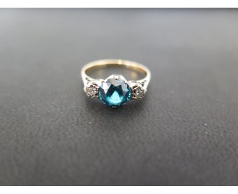 A zircon and diamond three-stone ring - Stamped 18ct - Ring size M - Weight approx 2.8gms
Condition Report: Good to fair - Wi