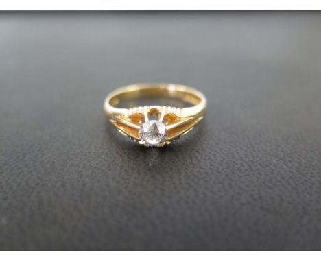 An 18ct gold diamond single-stone ring - The old-cut diamond within a raised claw setting to the plain band - Estimated diamo