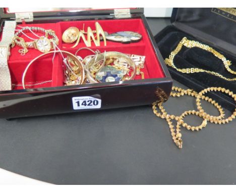 A quantity of vintage costume jewellery and some silver items including a bangle, locket etc.