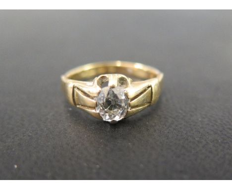 A late Victorian 18ct gold diamond single-stone ring - The old-cut diamond within a raised claw setting to the plain band - E