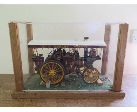 A model scratch built Traction Engine in case sporting the colours of A.T. Morley Amusements