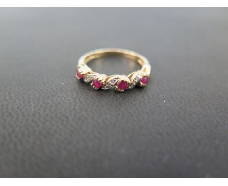 A 9ct gold ruby and diamond twist ring - Hallmarked Sheffield - Ring size M - Weight approx 2.1gms
Condition Report: Good