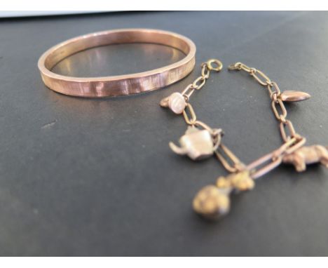 A 9ct gold textured bangle - Hallmarked Chester - Inner diameter 7.5cms - Weight approx 11.8gms - Together with a yellow meta