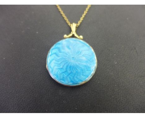 An guilloche enamel locket - Suspended from a belcher-link chain - Test as 9ct gold - Length of pendant 4cms - Length of chai