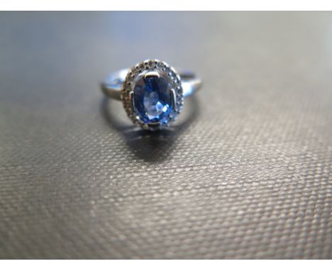 An 18ct gold sapphire and diamond cluster ring - Hallmarked Birmingham - Ring size L 1/2 - Weight approx 3.9gms
Condition Rep