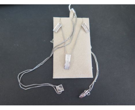 A 'Hot Diamond' set of jewellery - To include a pendant and a pair of earrings - Together with two further pendant necklaces 