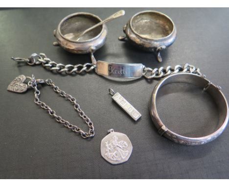 A collection of silver items - To include a bangle - two bracelets - Silver salts and spoon - All with marks indicating silve