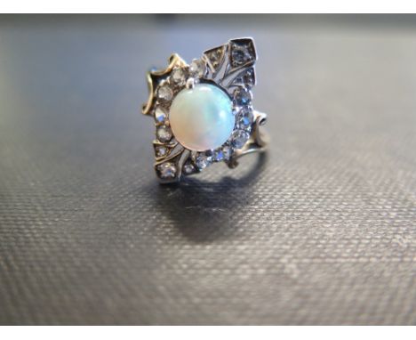 An opal and white-gem dress ring - Tests as 9ct gold - Ring size N - Weight approx 3.4gms
Condition Report: Good - With light