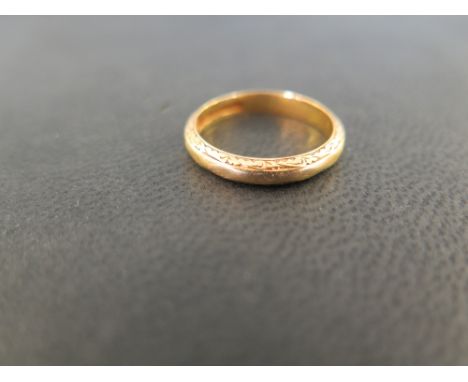 A 22ct gold band ring - With decorative border - Hallmarked Birmingham - Ring size N 1/2 - Weight approx 4.1gms
Condition Rep