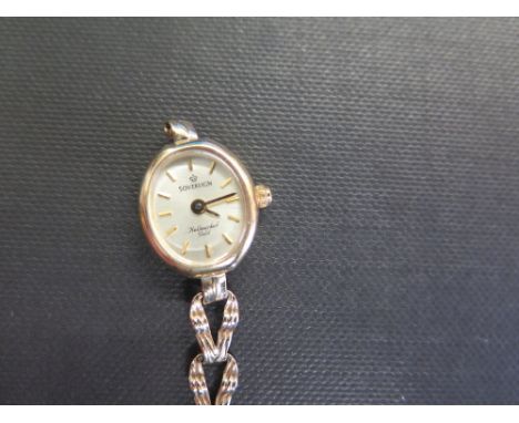 SOVEREIGN a 9ct gold ladies wristwatch - The baton markers to the openwork bracelet strap - Hallmarked Birmingham - Length 16