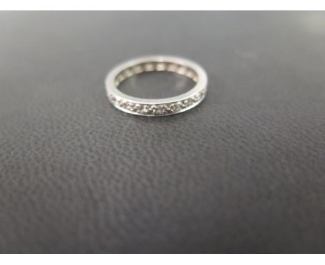 A brilliant-cut diamond full-circle band ring - Believed to be platinum - Ring size L 1/2 - Weight approx 3.3gms
Condition Re