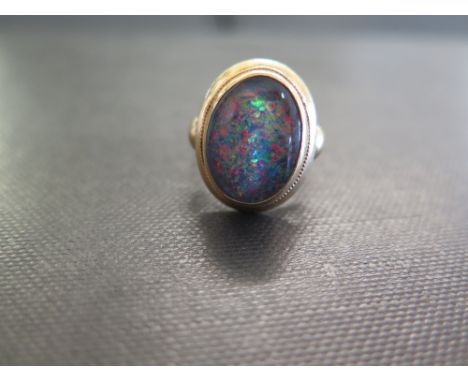 An opal triplet ring - Stamped 18ct - Ring size M 1/2 - Weight approx 6.3gms
Condition Report: Good to fair - With some light