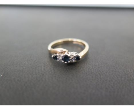 A 9ct gold sapphire and diamond dress ring - Hallmarked London - Ring size K 1/2 - Weight approx 2.6gms
Condition Report: Goo