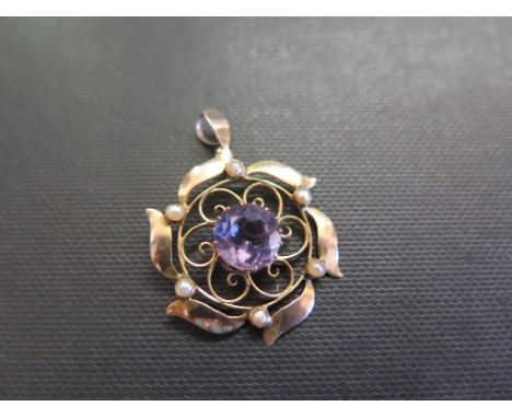 An early 20th century 9ct gold amethyst and seed pearl pendant - Length 3.5cms - Weight approx 2.0gms
Condition Report: Good 
