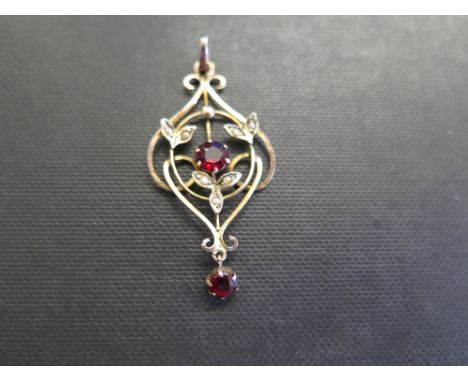 An early 20th century 9ct gold garnet topped doublet and seed pearl pendant - Length 4.5cms - Weight approx 1.9gms
Condition 