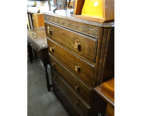 A vintage 'Fyne Lady' oak chest of five drawers together with a matching dressing table