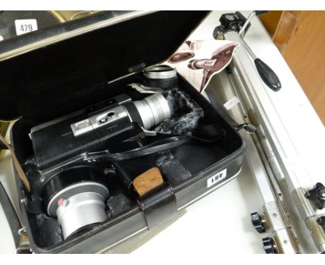 A vintage cased Canon Super 8 auto zoom camera & tripod stand