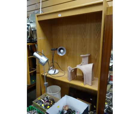 A modern narrow light oak bookcase