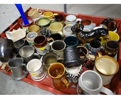 A crate of various metal & ceramic tankards