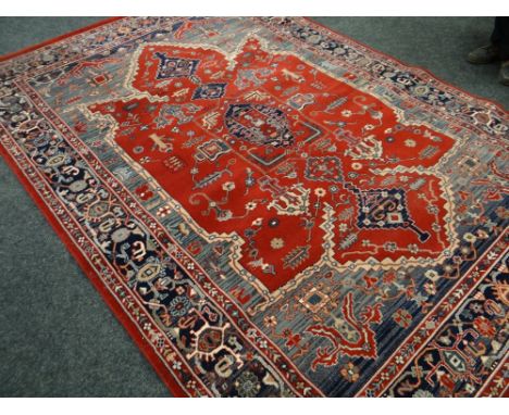 A large vintage patterned woollen rug, 198 x 286cms together with a similar large circular patterned rug 300 x 200cms