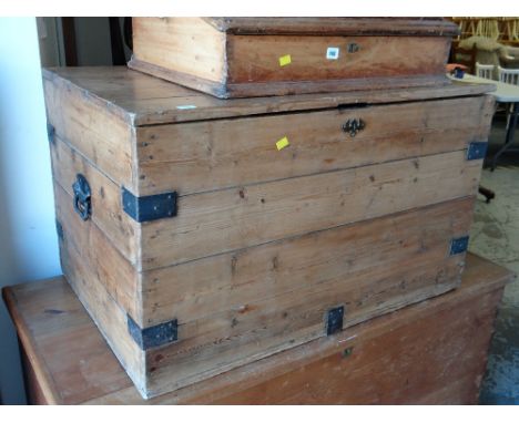 A large pine trunk with metal banding & carry handles