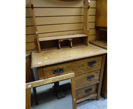 A light oak Arts & Crafts-style three-drawer dressing table