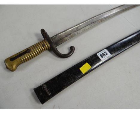 A large curved bayonet and scabbard