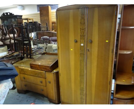 A vintage oak effect two-door wardrobe together with a matching mirrored dressing table