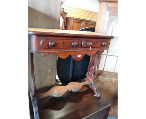 A vintage two-drawer pitch-pine console table with shaped frieze & legs