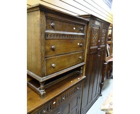 A vintage oak linen fold-style bedroom suite by Lock of London comprising two-door wardrobe, three-drawer chest of drawers & 