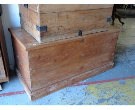 A large pine trunk with brass handles