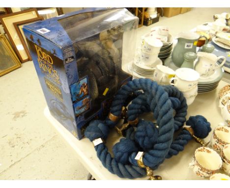 A boxed Lord of the Rings 'The Two Towers' electronic sound & action armored troll figure together with a coiled rope & brass