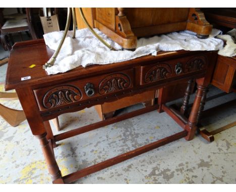 An Old Charm dark oak two-drawer console table